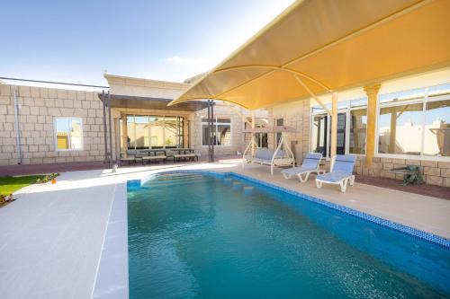 Al Jazirat Al Hamra Villa | 4BR Luxury villa with private pool and Majlis