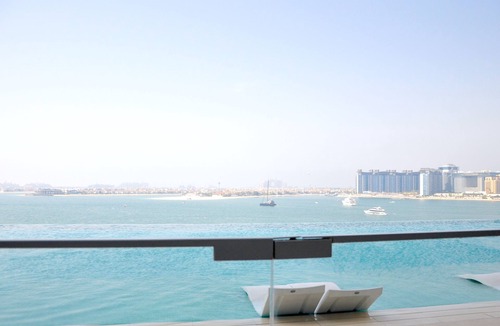 Trade Center Apartment | 2BR beachfront apartment with rooftop pool & Palm Jumeirah views