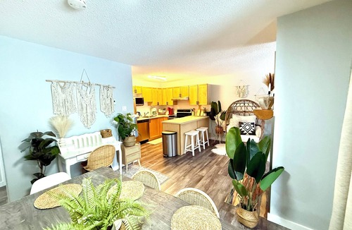 Panorama Condo | Boho theme, Ground floor patio with green space and creek view. 2 min to gondola