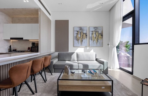 Madinat Zayed Apartment | Chic 1BR Retreat with Pool & Balcony JVC
