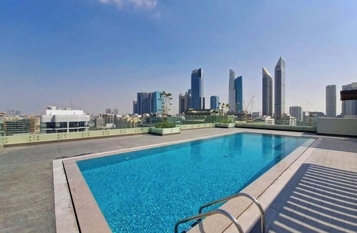 Al Satwa Apartment | Designer 1BR+Studywith DIFC Skyline View & Pool+Gym