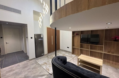 International City Apartment | Loft Studio with Elevated Mezzanine Bedroom