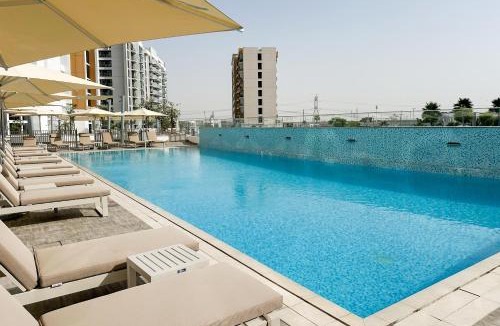 Nad Al Sheba Apartment | Riviera Living, Redefined - Stylish Studio with Pool and Balcony