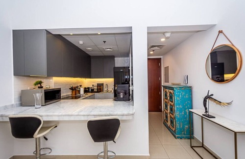 Al Hamra Village Apartment | Serene Lagoon Escape