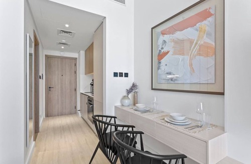Jumeirah Village Circle Apartment | Sun-Kissed Studio with Warm Terracotta Details