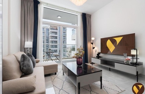 Discovery Gardens Apartment | Vogue Vacation Homes, Al Furjan Pearlz by Danube near Ibn Battuta Mall, One Bedroom Apartment with Balcony and vibrant community view, Access to all Amenities, Walkable to Al Furjan Metro Station