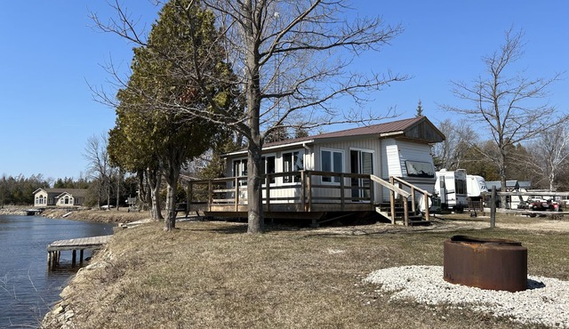 #0 Enjoy a waterfront view from your own trailer with a deck & sunroom in Lions Head