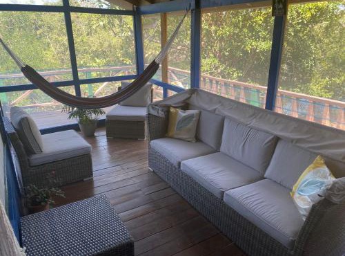 Amazing Jungle Tree House right over the river with bikes and canoe in Belize City