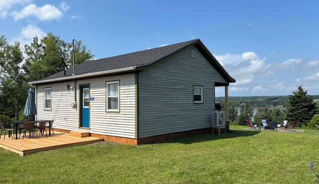 Peaceful river view cottage close to world class sandy beaches in Souris