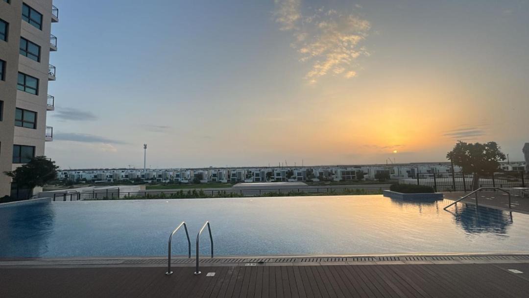 Dubai Apartment | Serene Golf Escape 2BR, Pool, Near Expo and Airport