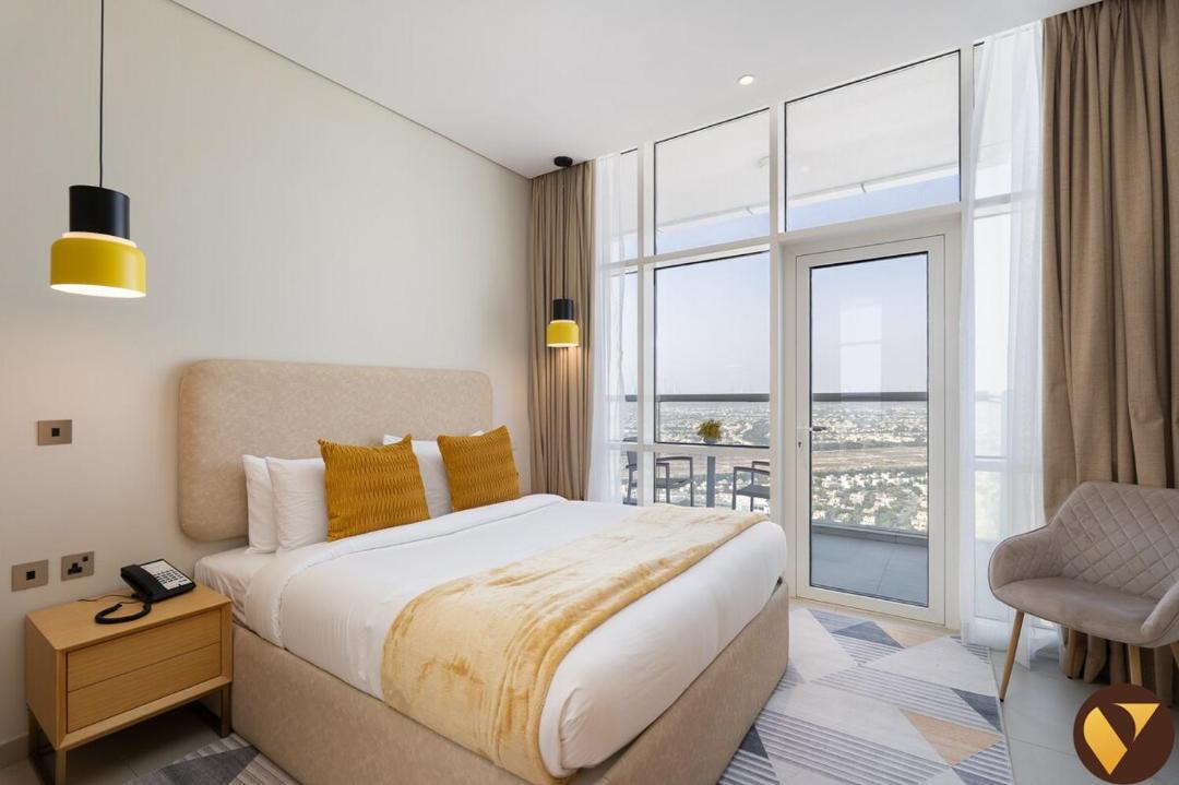 Jumeirah Village Triangle Apartment | Vogue Vacation Homes, Novotel Residences JVT near Springs Souk Mall, One Bedroom apartment with Balcony and Vibrant Community View, Access to all Amenities