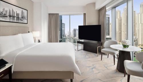 Premier Marina View Suite, King bed, Sofa bed, Club lounge access with Breakfast, Lunch & Dinner, 4PM Late checkout, Including direct access to Dubai Marina Mall & Marina Walk   