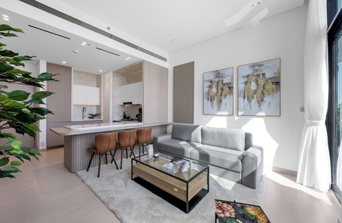 Madinat Zayed Apartment | Chic 1BR Retreat with Pool & Balcony JVC