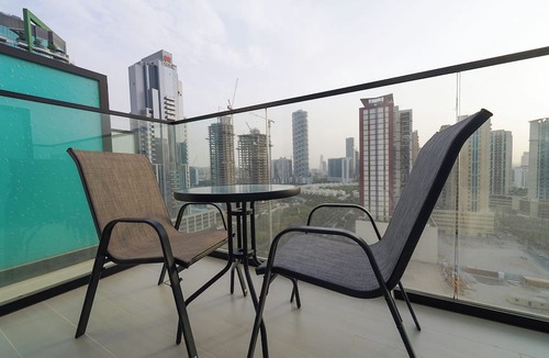 Jumeirah Village Circle Apartment | Modern Studio with Balcony Views of FIVE Hotels