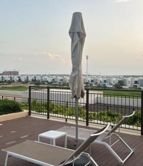 Dubai Apartment | Serene Golf Escape 2BR, Pool, Near Expo and Airport