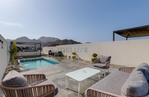 Sharm Apartment | Blue Marble Beach 4BR Villa with Assistants Room, Private Pool, Access to Floating Pier, and Sea and Mountain Views, Al Dana Island, Fujairah by Deluxe Holiday Homes