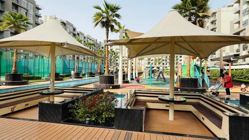 International City Apartment | Lawnz Luxury furnished studio with Balcony Swimming Pool Gym Kids play ground