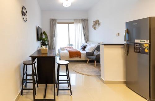 Jumeirah Village Circle Apartment | Serene studio apartment with Burj Khalifa view in Jumairah Village Circle JVC