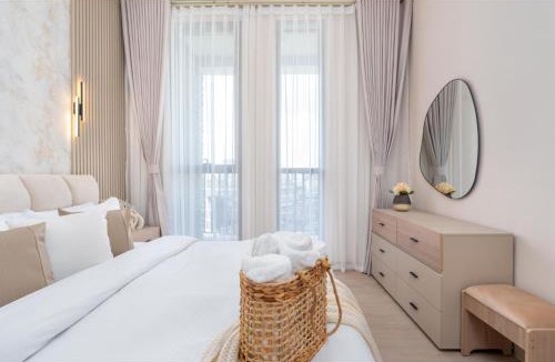Dubai Production City Apartment | Bright and Modern 1BR Midtown Near Expo Site by Vibel