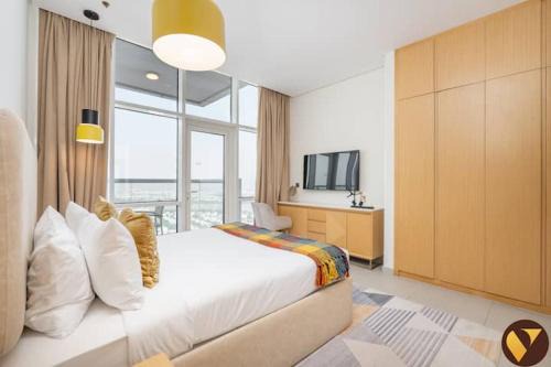 Vogue Vacation Homes, Novotel Residences JVT near Springs Souk Mall, One Bedroom Apartment with Large Balcony and Vibrant Community view, Access to all Amenities